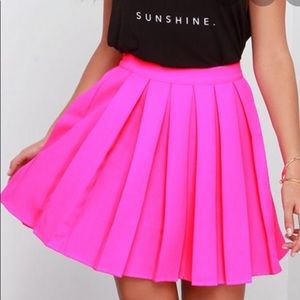 Pleated neon pink skirt
